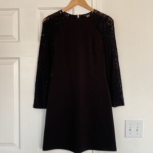 Tommy Hilfiger little black dress with long sleeves lace sleeves.